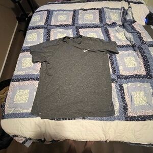 Men’s Nike swim shirt.